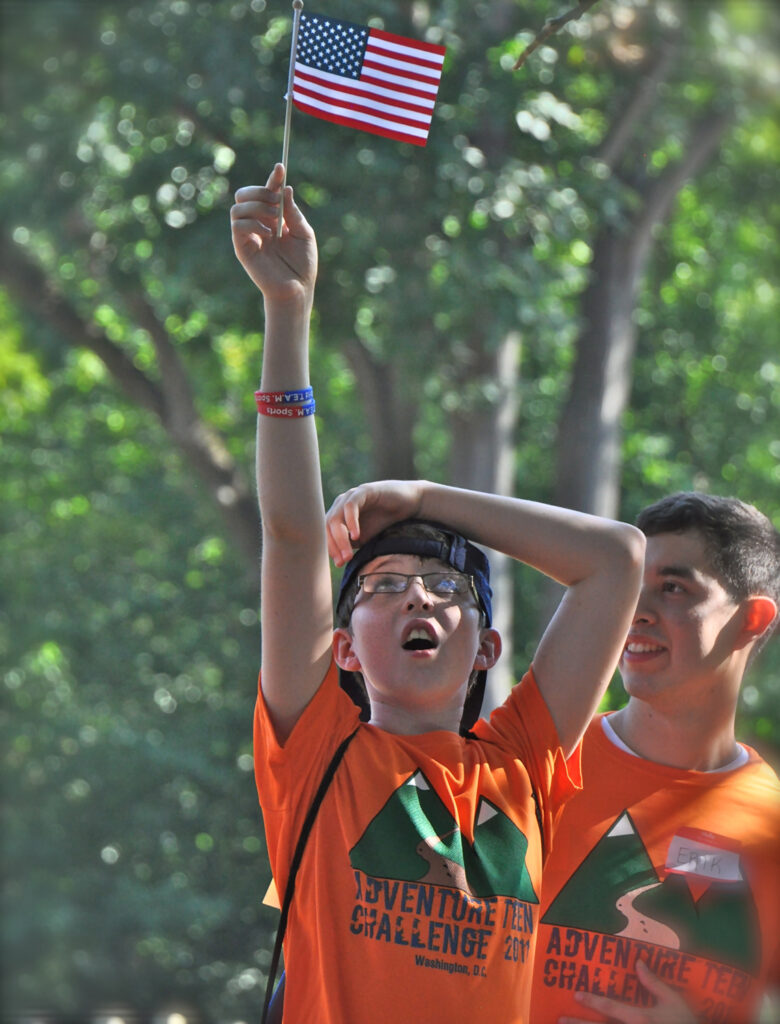 Adventure Team Challenge athlete celebrates.