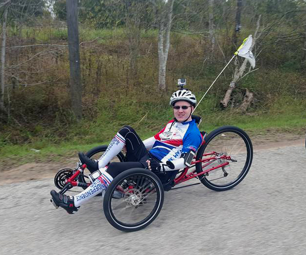 Brian Steere on a recumbent bicycle.