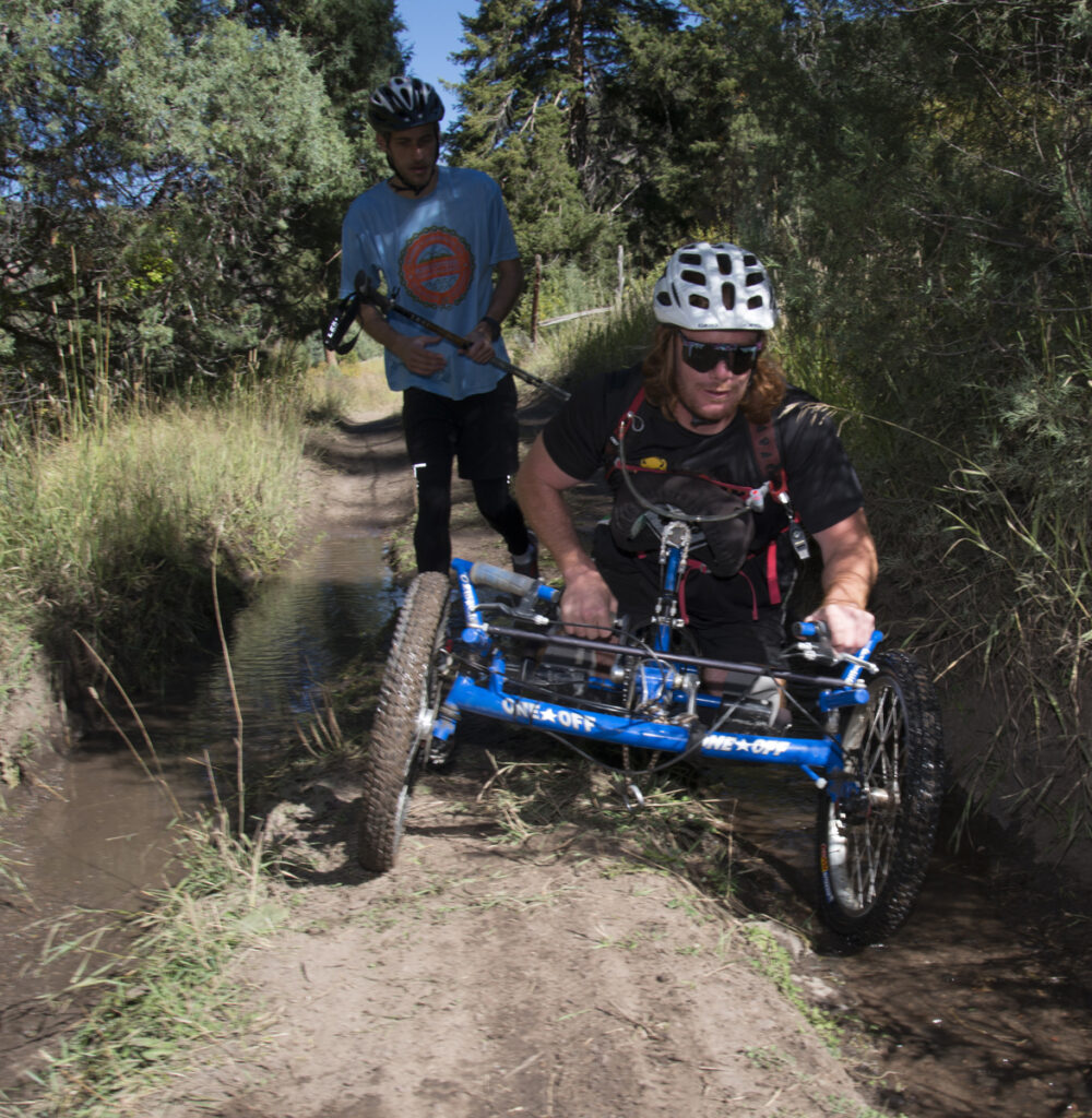 Riding a One Off hand cycle.