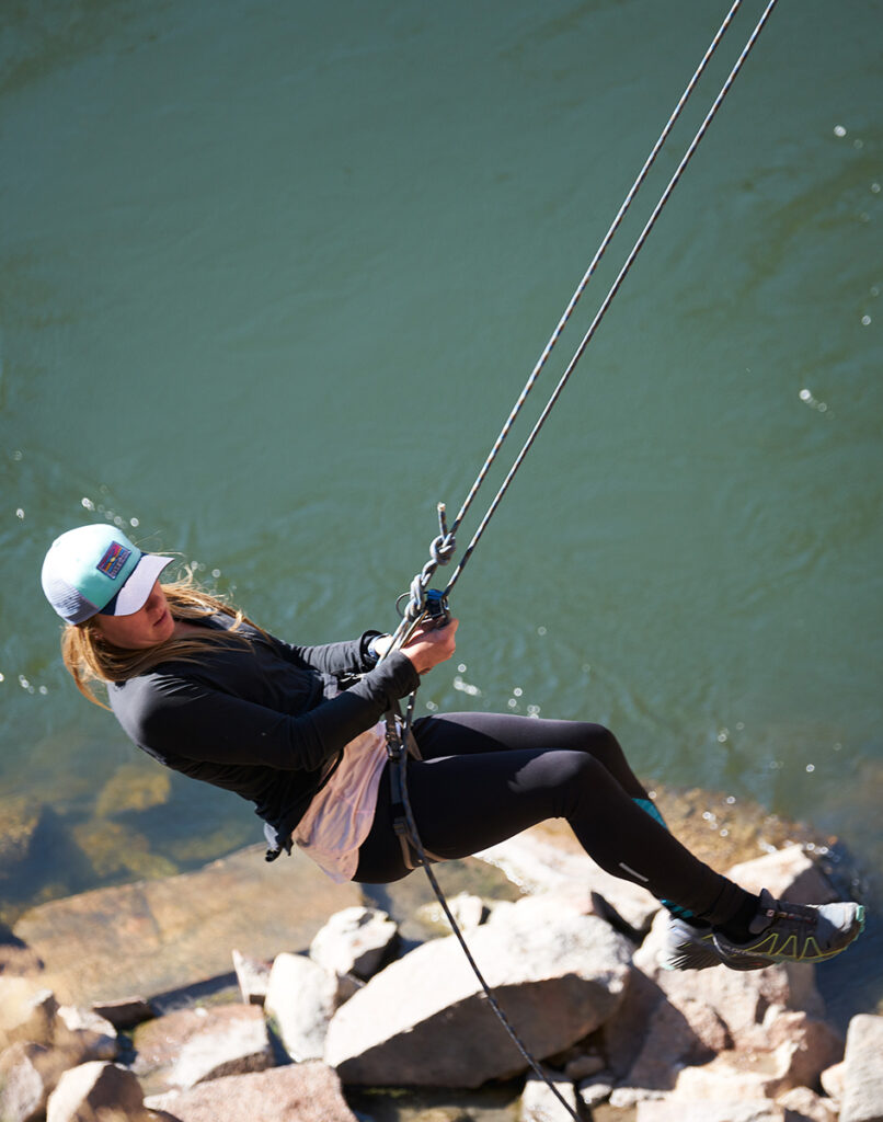 Rappelling off a granite cliff.